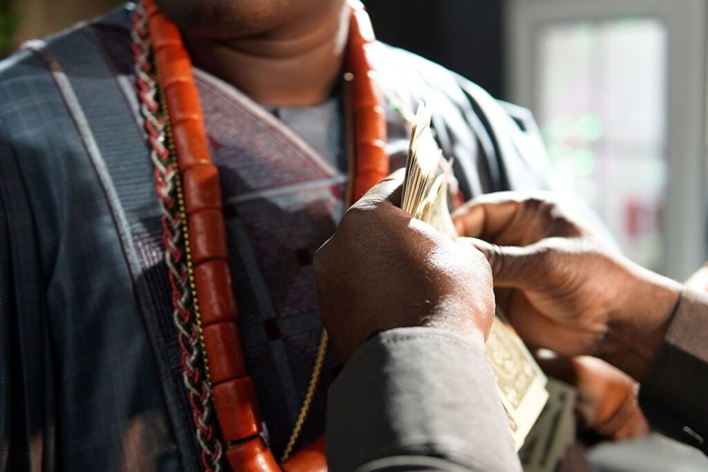 Nigerian Man being Sprayed Money